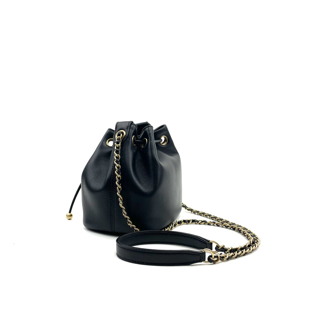 CHANEL Logo Charm CC Lambskin Drawstring Bucket Bag